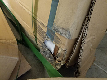 sauna packaging with visible shipping damage